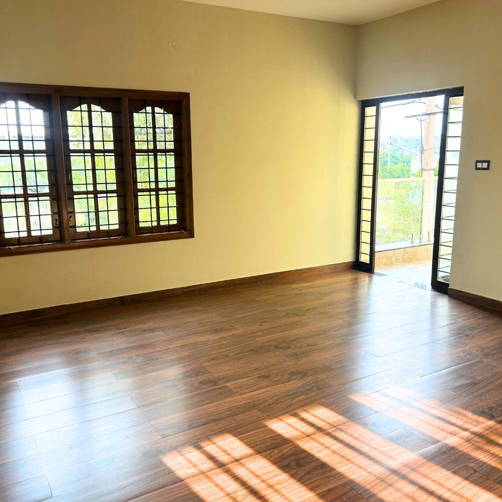 Interior room with wooden flooring and large windows